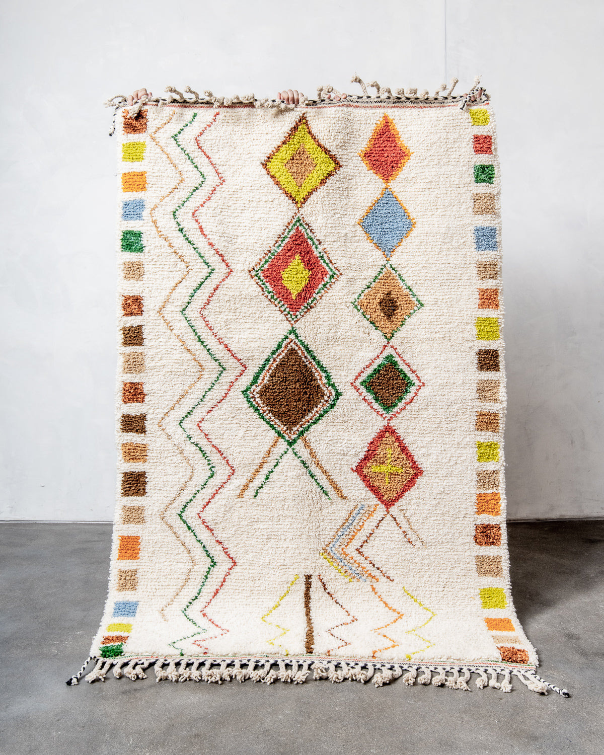 Modern, designer, handcrafted Berber rug from Morocco. Beniourain carpet with beautiful colours and patterns and fluffy wool texture.